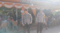 Bhabinkamtibmas Polsek Air Besar Berikan Pelayanan dan Pengamanan di Acara Pesta Pernikahan Warga